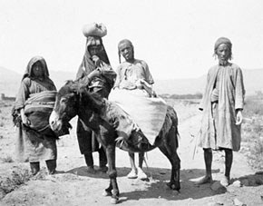 Historical photo of a Yemenite Jewish family with a donkey